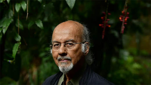 T J S George